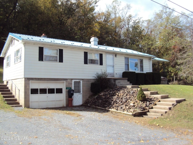 view of front of property with a garage