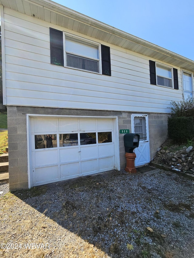 view of side of home featuring a garage