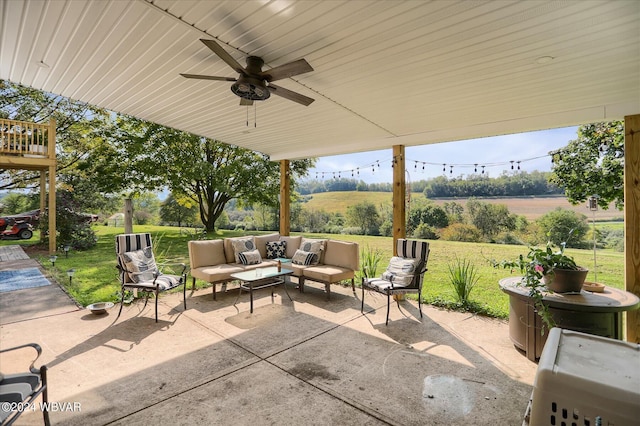 view of patio / terrace with an outdoor hangout area, ceiling fan, and a rural view