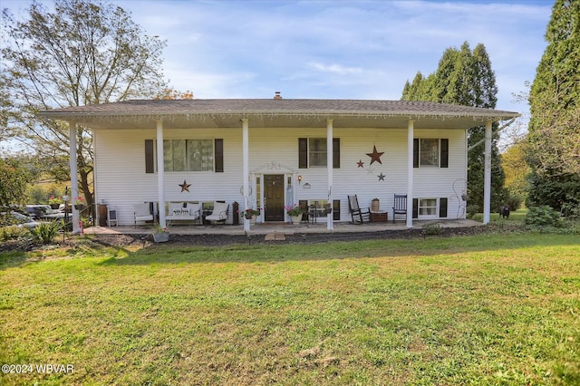 bi-level home featuring a patio area and a front lawn