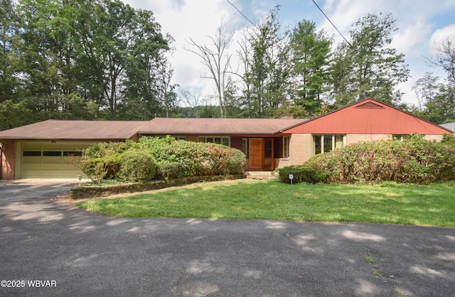 715 Park Ave, Lock Haven, PA 17745 - ranch-style house with an attached garage, driveway, brick siding, a front lawn, and a chimney