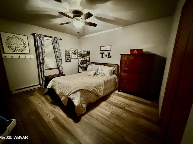 bedroom with baseboard heating, ceiling fan, and wood-type flooring