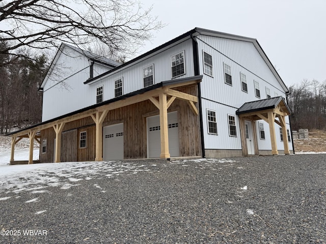 modern farmhouse featuring a garage