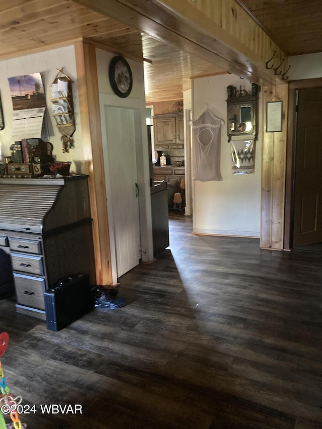 hall featuring dark hardwood / wood-style flooring, beam ceiling, and wooden ceiling