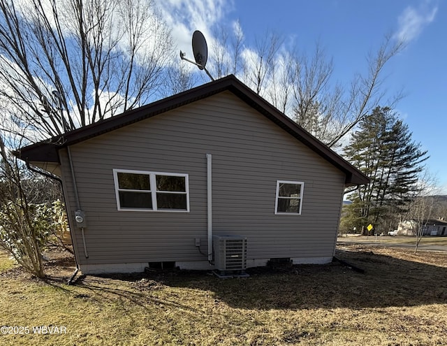 view of home's exterior with cooling unit