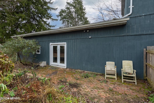 view of side of property featuring french doors and a patio