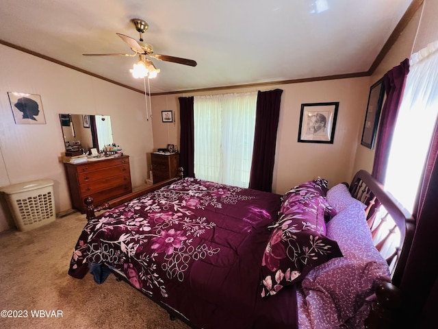 bedroom featuring carpet, vaulted ceiling, ceiling fan, and ornamental molding