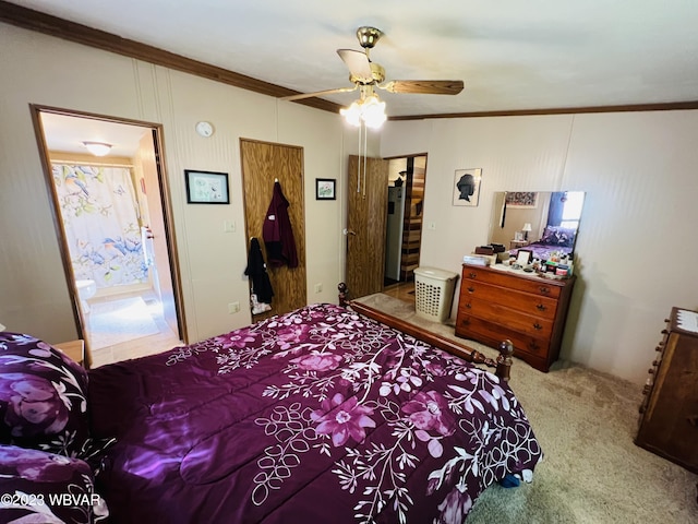 bedroom with carpet flooring, ensuite bathroom, ceiling fan, and crown molding