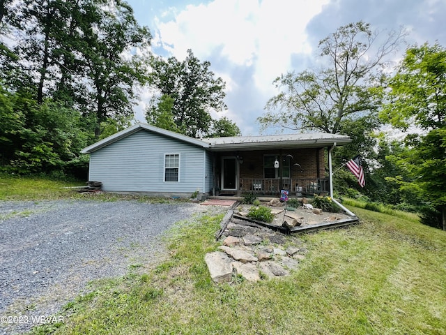 back of property featuring a porch