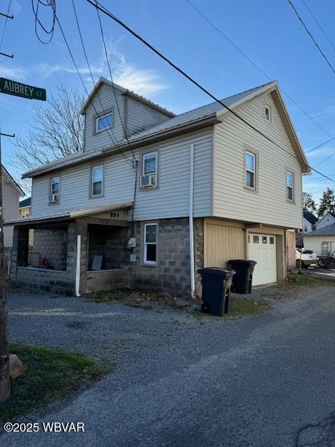 view of side of home with a garage