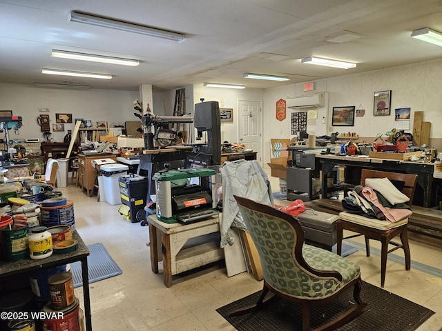 11 Mikes Peak Ln, Lock Haven, PA 17745 - miscellaneous room with an AC wall unit, a workshop area, and light flooring