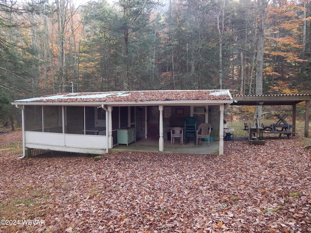 exterior space featuring a sunroom