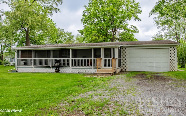422 Mcelhattan Dr, Lock Haven, PA 17745 - view of front of house featuring dirt driveway, an attached garage, a sunroom, and a front lawn