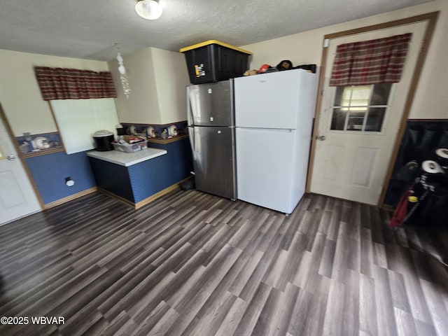 4316 Pine Mountain Rd, Jersey Shore, PA 17740 - kitchen with dark wood finished floors, freestanding refrigerator, a textured ceiling, baseboards, and light countertops
