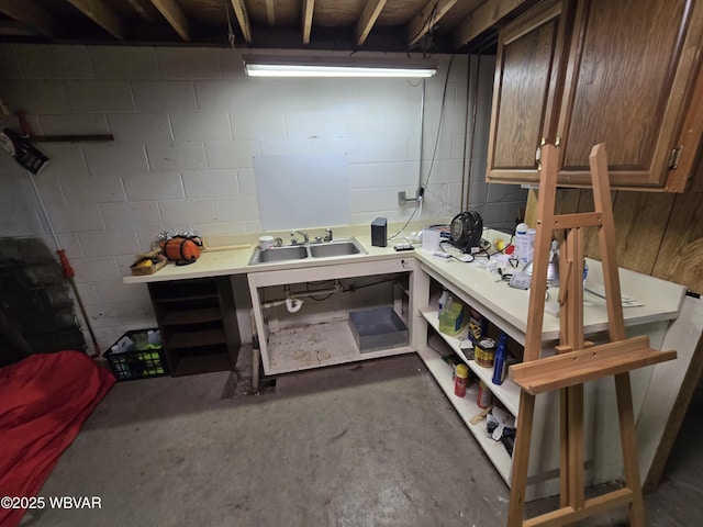 4316 Pine Mountain Rd, Jersey Shore, PA 17740 - miscellaneous room with concrete flooring, concrete block wall, a workshop area, and a sink
