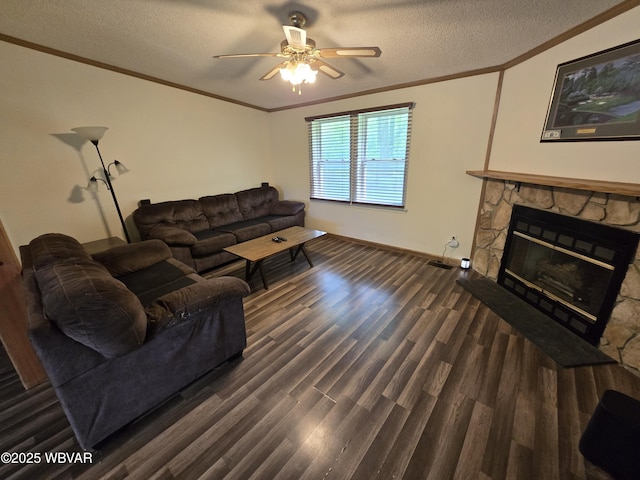 4316 Pine Mountain Rd, Jersey Shore, PA 17740 - living room with ornamental molding, a ceiling fan, dark wood-style flooring, a fireplace, and a textured ceiling