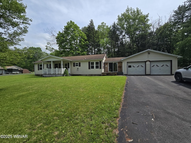 4316 Pine Mountain Rd, Jersey Shore, PA 17740 - single story home featuring covered porch, a front yard, asphalt driveway, and a garage
