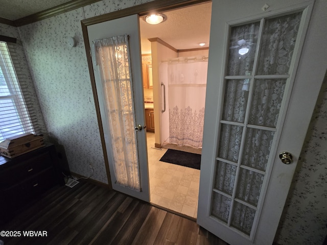 4316 Pine Mountain Rd, Jersey Shore, PA 17740 - doorway to outside featuring crown molding, wallpapered walls, and wood finished floors