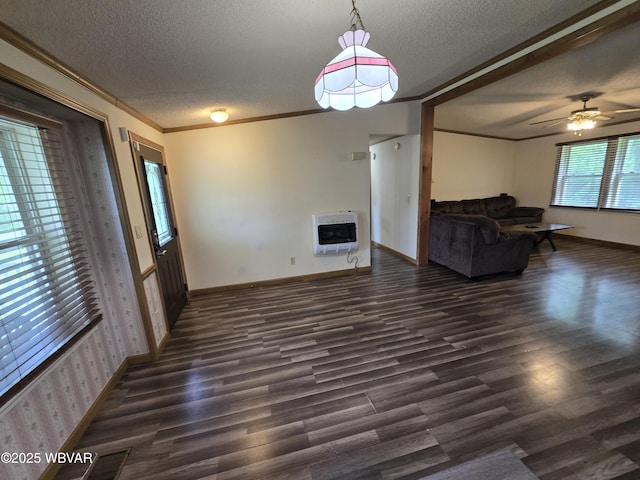4316 Pine Mountain Rd, Jersey Shore, PA 17740 - unfurnished living room with heating unit, a textured ceiling, dark wood finished floors, crown molding, and baseboards