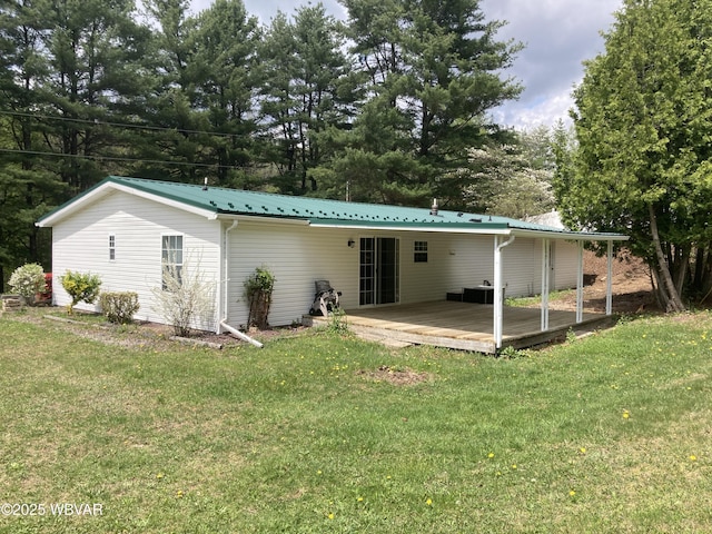 400 Livermore Rd, Williamsport, PA 17701 - back of property featuring a wooden deck, a yard, and metal roof