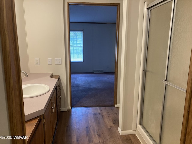 400 Livermore Rd, Williamsport, PA 17701 - full bathroom featuring vanity, visible vents, wood finished floors, and a stall shower