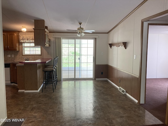 400 Livermore Rd, Williamsport, PA 17701 - kitchen featuring visible vents, a kitchen breakfast bar, a ceiling fan, backsplash, and dishwasher
