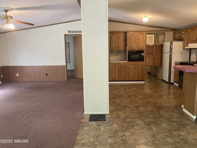 400 Livermore Rd, Williamsport, PA 17701 - kitchen featuring a ceiling fan, visible vents, black microwave, lofted ceiling, and under cabinet range hood