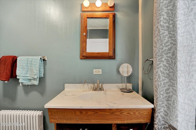 679 2nd Ave, Williamsport, PA 17701 - full bathroom with radiator, vanity, and a shower with curtain