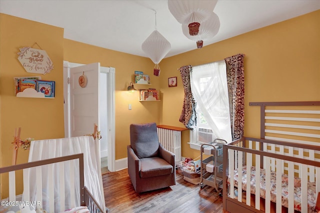 679 2nd Ave, Williamsport, PA 17701 - bedroom with wood finished floors and baseboards