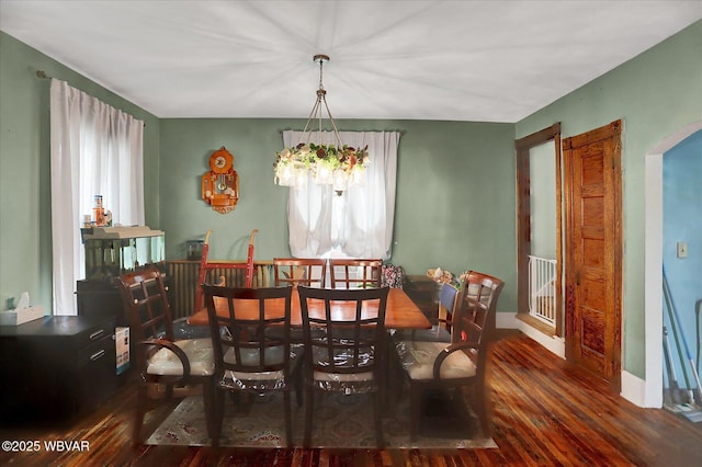 679 2nd Ave, Williamsport, PA 17701 - dining room with wood finished floors, a chandelier, and arched walkways