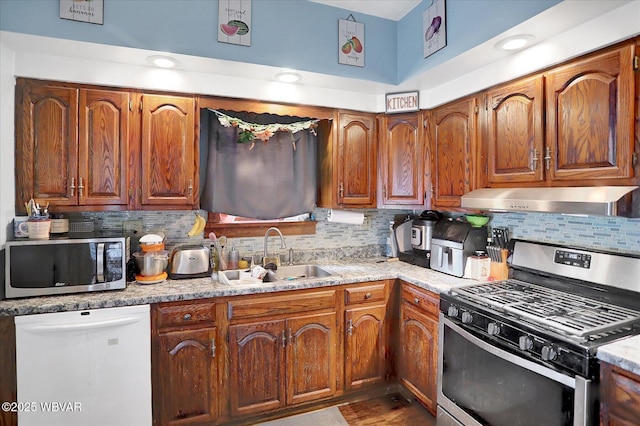 679 2nd Ave, Williamsport, PA 17701 - kitchen featuring appliances with stainless steel finishes, range hood, decorative backsplash, and light countertops