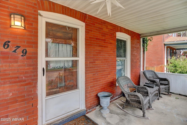 679 2nd Ave, Williamsport, PA 17701 - doorway to property with brick siding, a porch, and ceiling fan