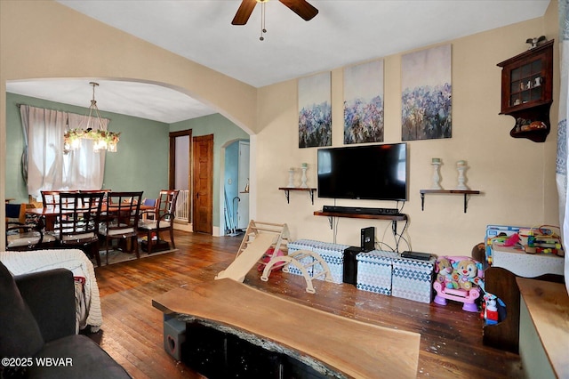 679 2nd Ave, Williamsport, PA 17701 - living room featuring arched walkways, wood finished floors, ceiling fan, and a chandelier
