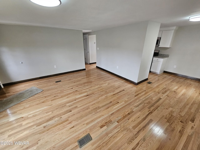 353 Louise Ave, Montgomery, PA 17752 - spare room with light wood finished floors, baseboards, and visible vents