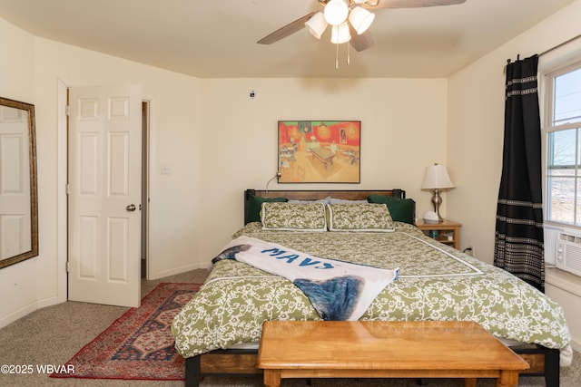 bedroom featuring multiple windows, ceiling fan, and light carpet