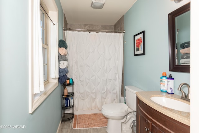 bathroom featuring hardwood / wood-style floors, vanity, and toilet