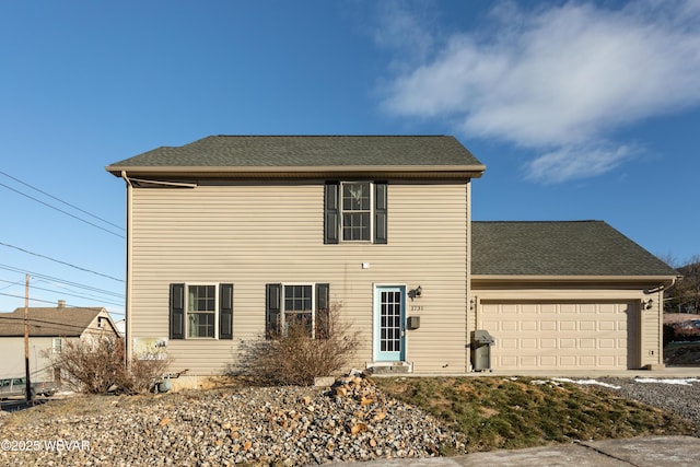 view of front of property featuring a garage