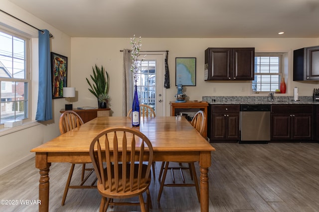 dining area with hardwood / wood-style floors and a wealth of natural light