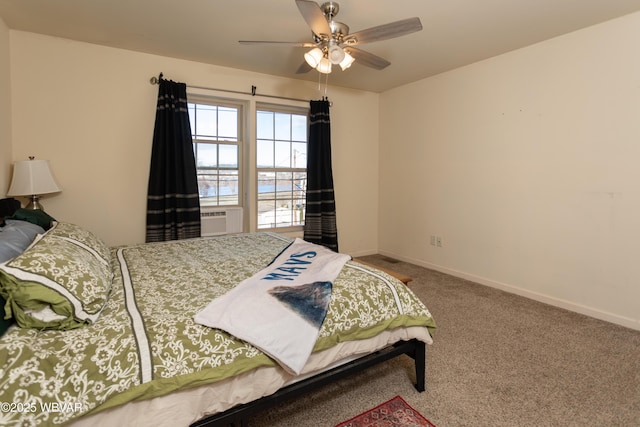 bedroom with carpet floors, ceiling fan, and cooling unit