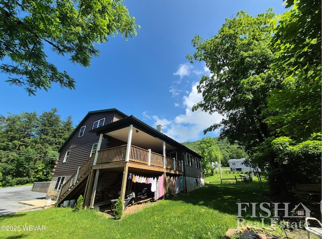 3178 W Winter Rd, Loganton, PA 17747 - rear view of house featuring stairs, a yard, and a wooden deck