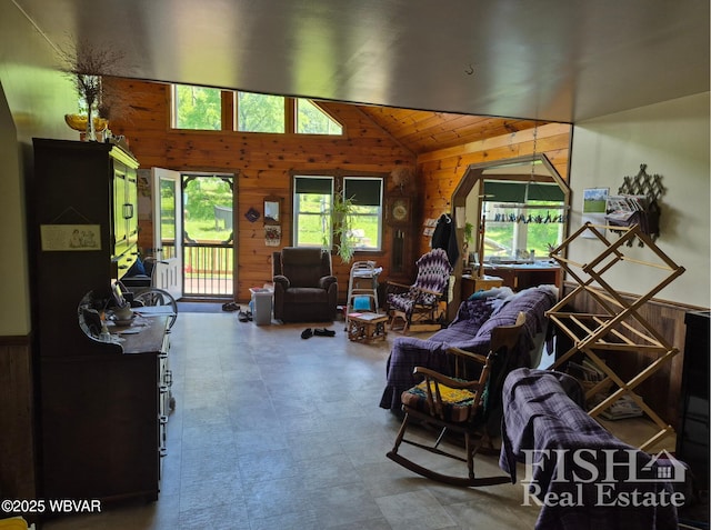 3178 W Winter Rd, Loganton, PA 17747 - living room featuring wooden walls, vaulted ceiling, and tile patterned floors