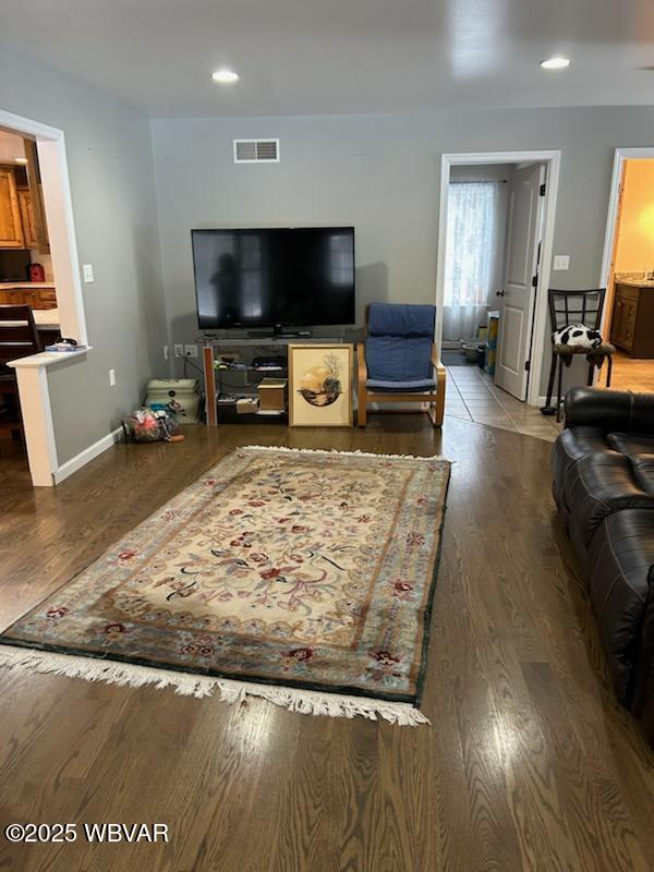 living room with dark wood-type flooring