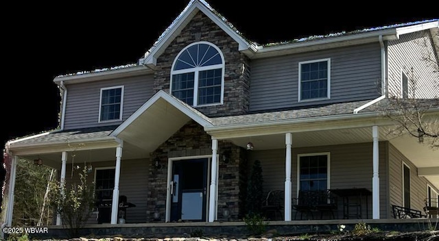 view of front of property featuring covered porch