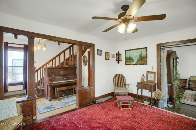 sitting room featuring hardwood / wood-style floors and ceiling fan