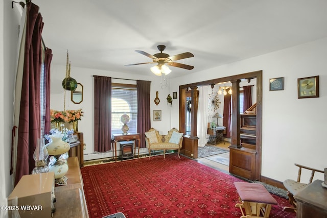 living area featuring ceiling fan