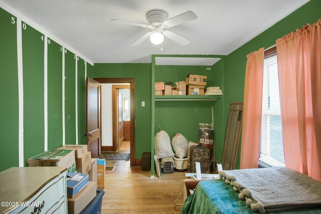 bedroom featuring ceiling fan and light hardwood / wood-style flooring