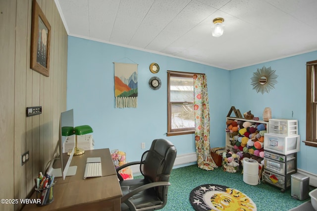 carpeted office space featuring crown molding and wooden walls