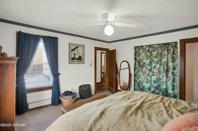 carpeted bedroom featuring crown molding, a baseboard radiator, and ceiling fan