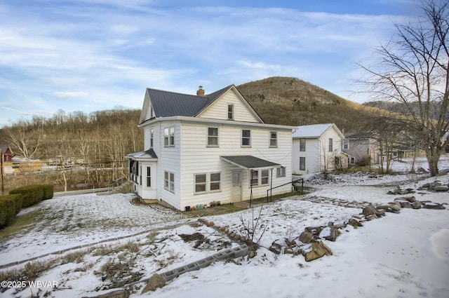 view of snow covered property