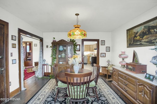 dining room featuring dark wood-type flooring